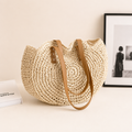 Bolso redondo de rafia trenzada Lisa en beige